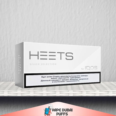 HEETS Silver Selection for IQOS packaging on a white surface with a gray background