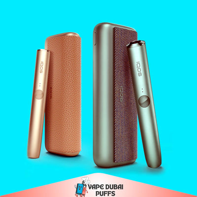 IQOS Iluma Prime Device Kit devices on a blue background with 'Vape Dubai' branding.