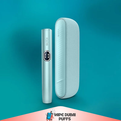 IQOS Iluma i Standard Breeze Blue Device Kit and case on a teal background with 'Vape Dubai' branding.